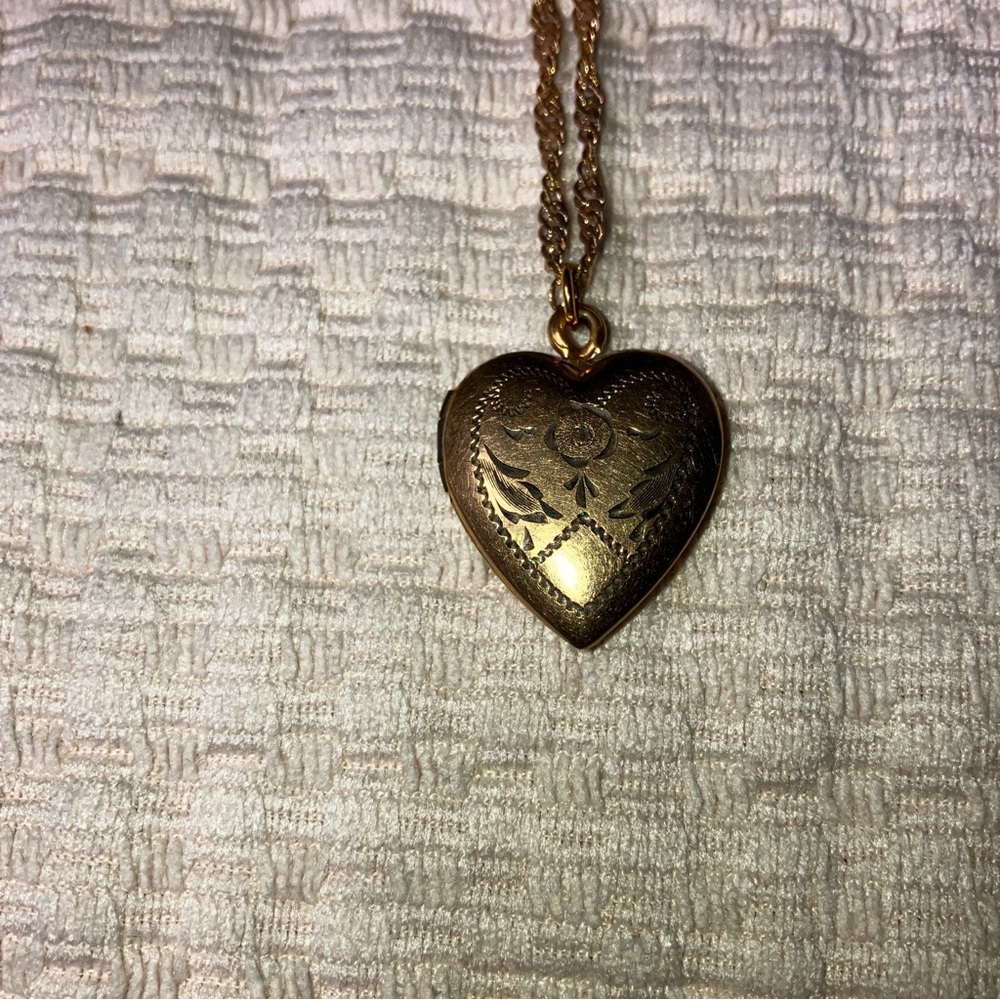 Locket Heart shaped with flowers engraved on gold filled. Lovely Vintage piece.